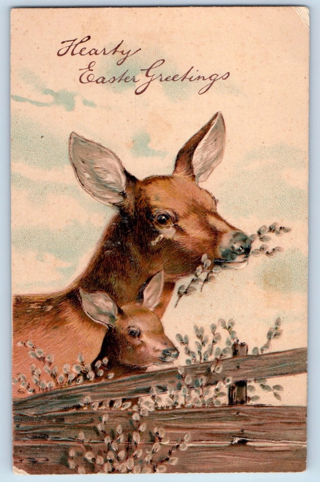 stara kartka wielkanocna, dwie sarny/jelenie stoją przy płocie z baziami